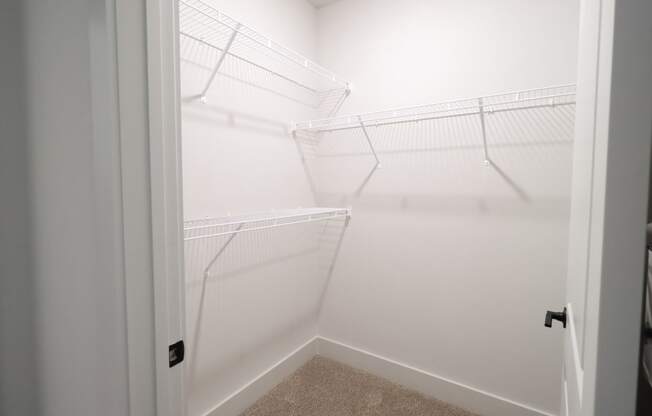 The Crest at South Point B3 Model Apartment Main Bedroom Walk In Closet located in McDonough, GA