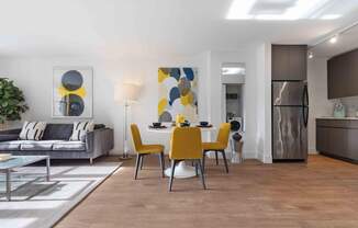 Open concept living area with wood-look plank flooring