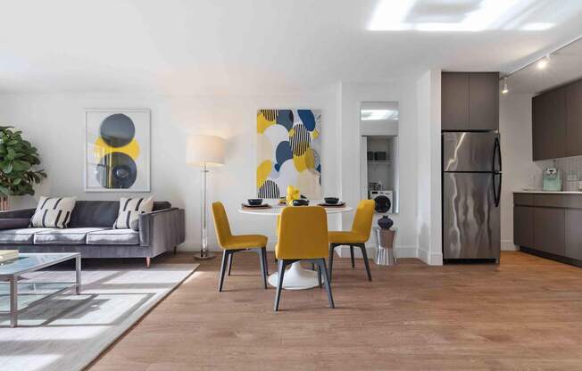 Open concept living area with wood-look plank flooring