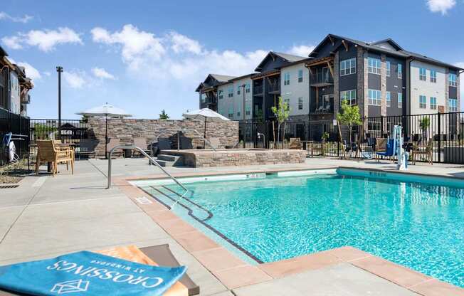 A pool with a blue cover that says