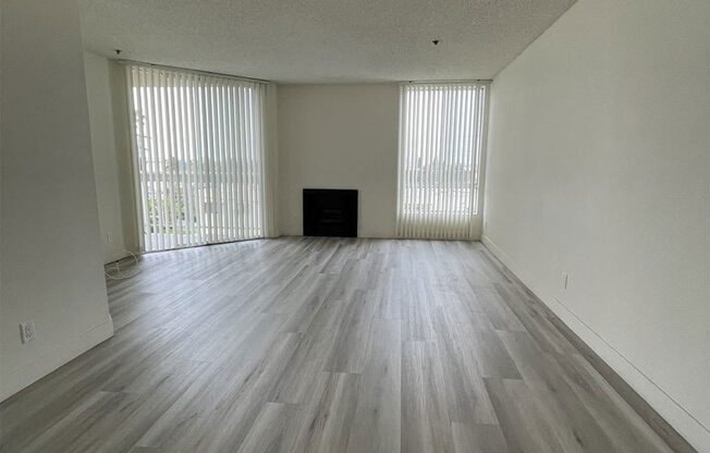 Living Room with Hardwood Floors, Fireplace and Patio Doors