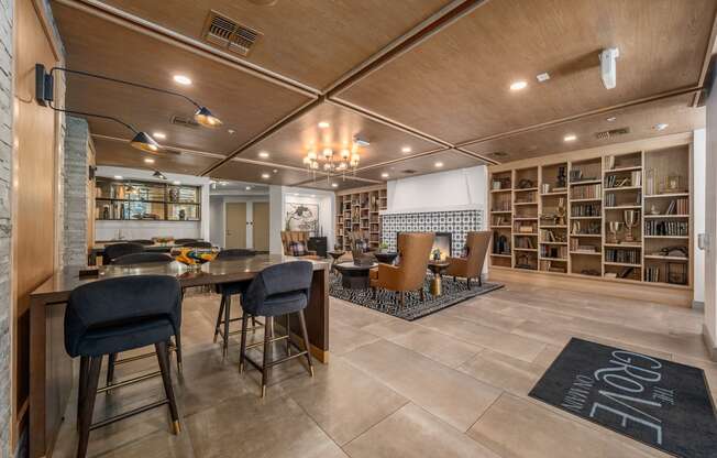 a living room and dining room with a table and chairs