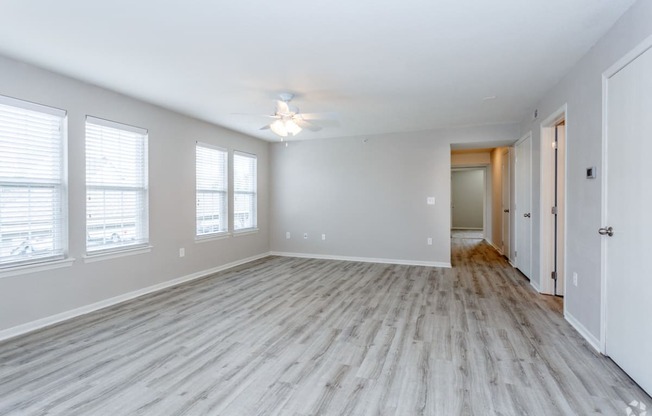 Living room with vinyl plank flooring and windows