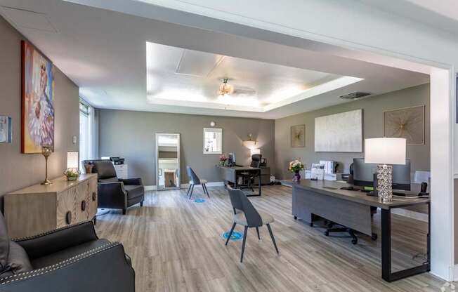 A modern office space with a variety of furniture and decor.