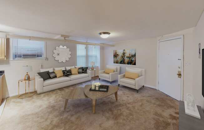 living area with large windows, sofa, coffee table, hardwood floors and view of kitchen at 1818 riggs apartments in washington dc