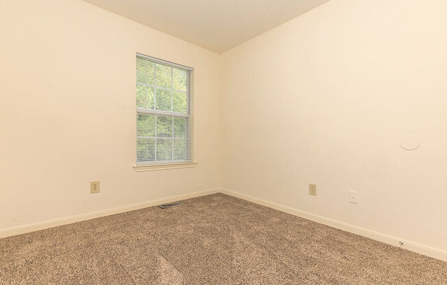 Bedroom with window at Greens of Pine Glen in Durham NC