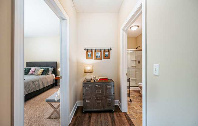 a living room with luggage on the floor and a staircase