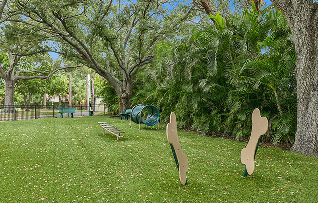 Community Dog Park with Agility Equipment at Huntington Place Apartments located in Sarasota, FL.
