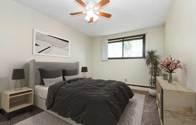 White Bear Lake, MN White Bear Terrace Apartments. a bedroom with a large bed and a ceiling fan