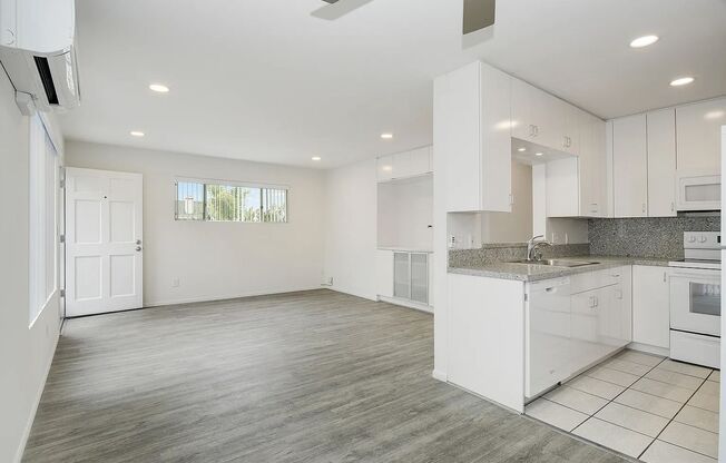 FABULOUS location!  4 blocks to the ocean & Sail Bay, AIR-CONDITIONING, IN-UNIT LAUNDRY! PRIVATE GARAGE + Addn Parking