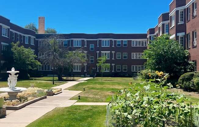 A large building with a fountain in front of it.