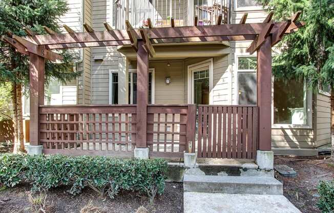 the front porch of a house with a wooden deck at Delano, Redmond, 98052