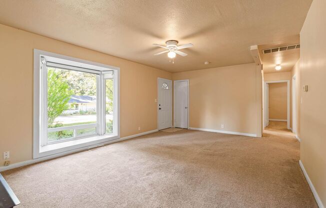 Charming, retro 2-bdrm/2-bath ranch w/ large family room in tranquil setting