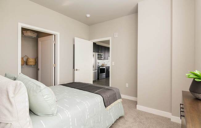 A bedroom with a bed and a couch.