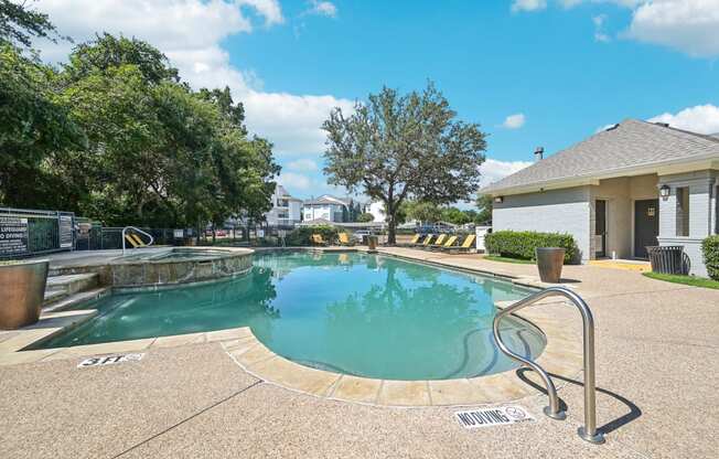 the preserve at ballantyne commons pool and spa with building and trees