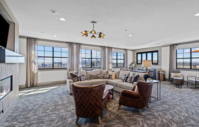 a living room with couches and chairs and a fireplace at Alton Jefferson Park, Denver, CO 80211