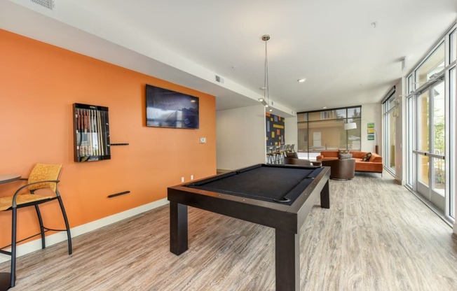 Community Clubhouse Pool Table, Hardwood Inspired Floor, Orange Walls and Window