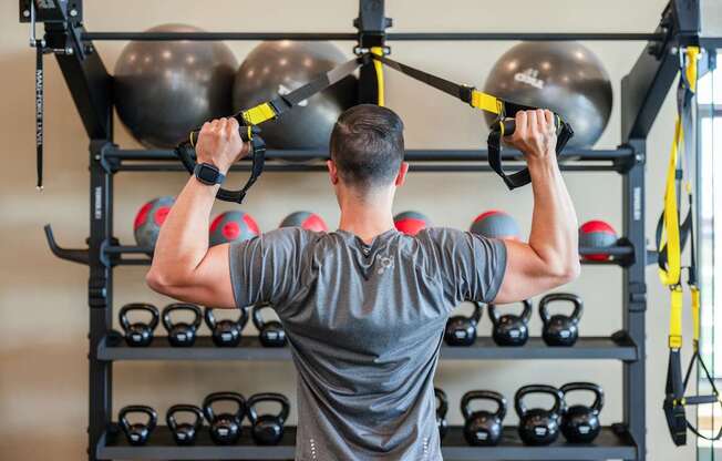 a man working out in a gym with weights