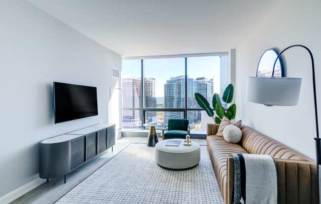 a living room with a couch and a large window