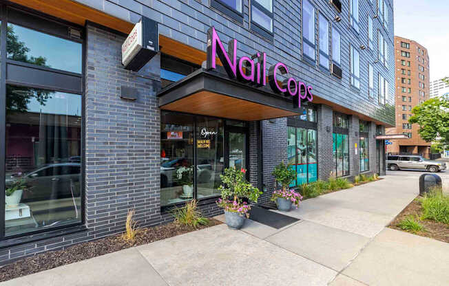 A nail salon called Nail Cops is located in a modern building.