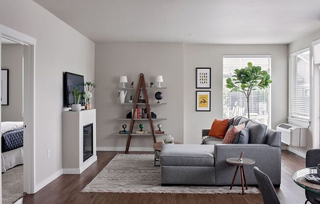 a living room with a fireplace and a couch