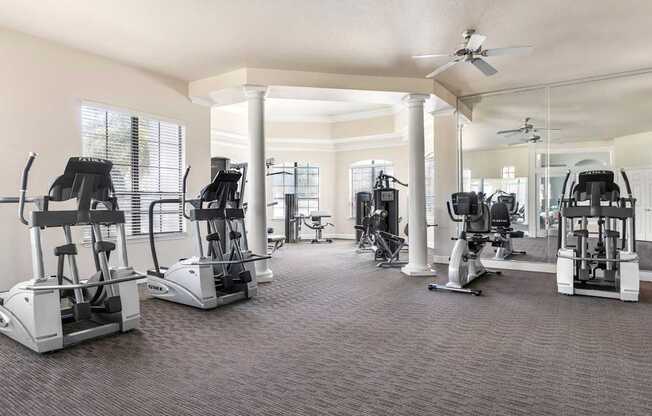 A spacious gym with a variety of exercise equipment.