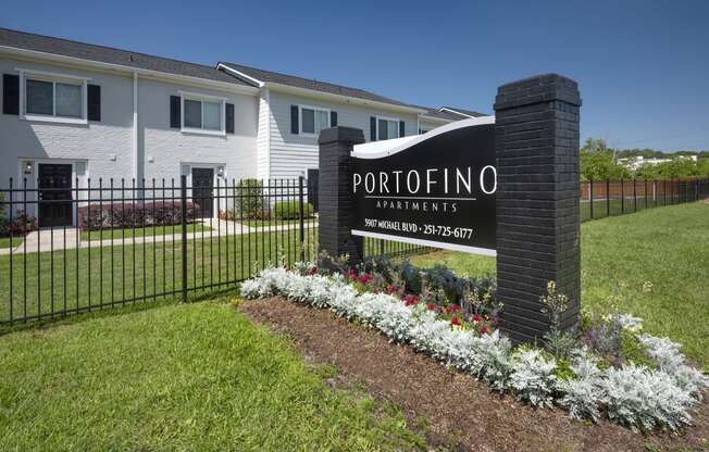 a rendering of a apartments sign in front of a fence