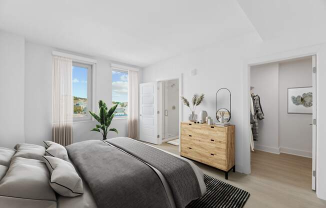 a bedroom with a bed and a dresser  at Link Apartments® H Street, Washington, 20002