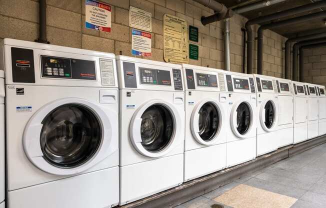 a row of washing machines in a laundromat