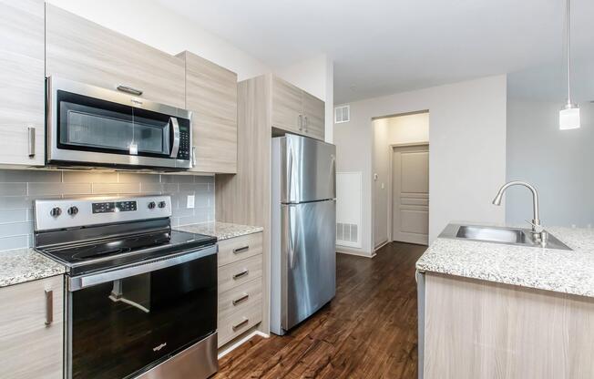 a large kitchen with stainless steel appliances