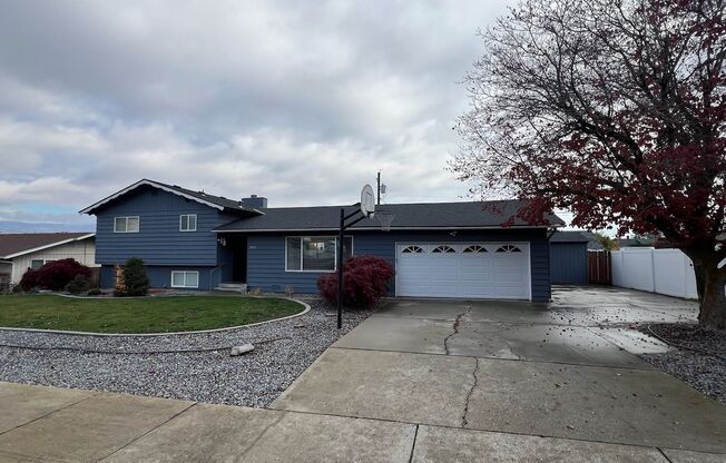 SPACIOUS 4 bed/2 bath home in desired location with double garage, fenced back yard!