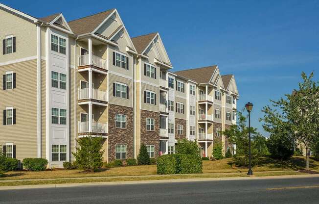 an apartment building on the side of a street