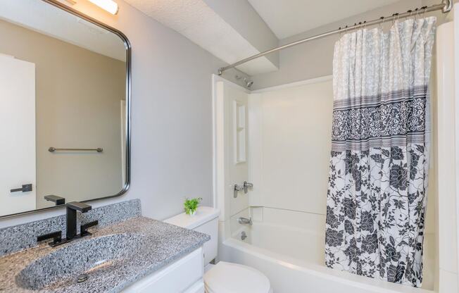 large bathroom with shower and tub combo