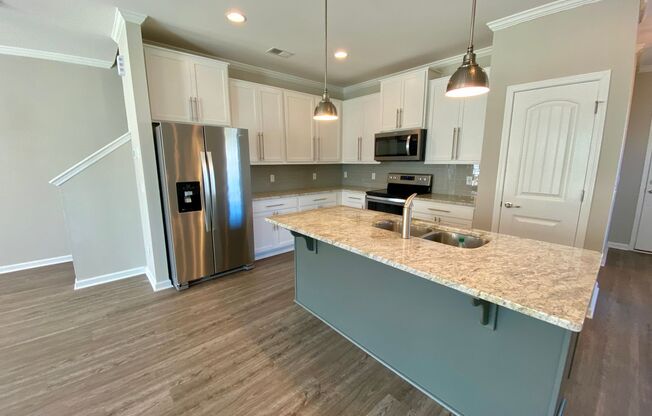 3 bed/2.5 bath at end unit townhome in Berkeley Walk at Savannah Quarters with garage