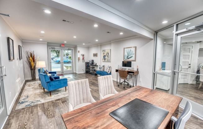 a dining room and living room with a table and chairs