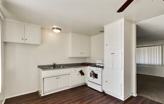 Kitchen with wood inspired floors throughout the dining area