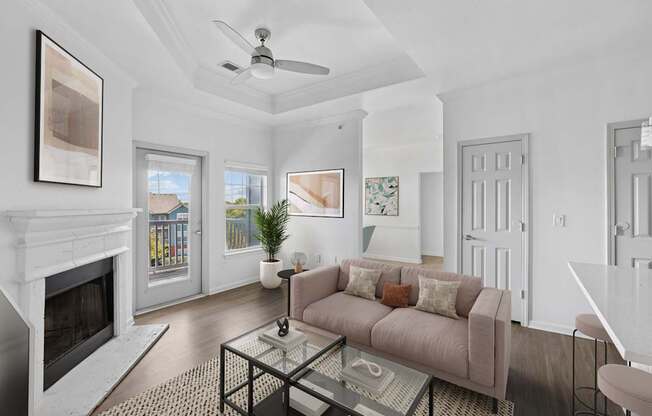 A living room with a fireplace and a couch.