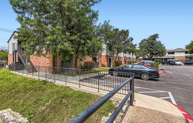 a car parked in a parking lot in front of a building