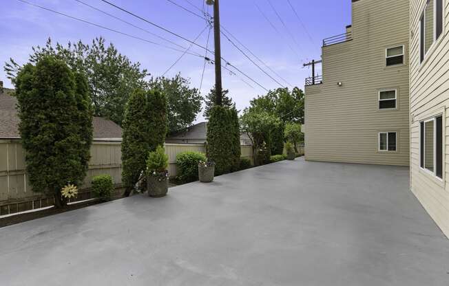 Side view of the building with outdoor space at Hill Crest Apartment Homes, Seattle, Washington 98126