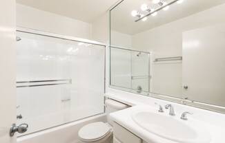 Bathroom with White Cabinets and Bathtub/Shower