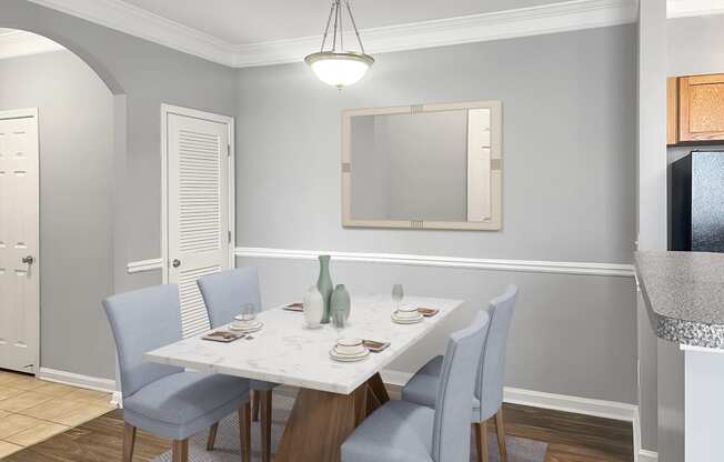 an image of a dining room with a table and chairs