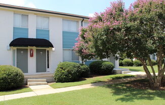 crepe myrtles blooming in front of Sherwood Park Apartments in Huntsville  at Huntsville Landing Apartments, Huntsville, Alabama