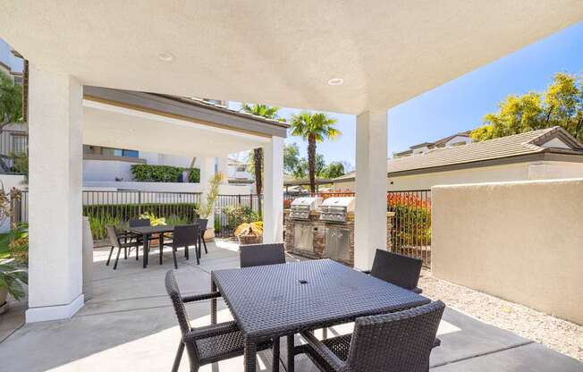 A patio with a table and chairs is shown.
