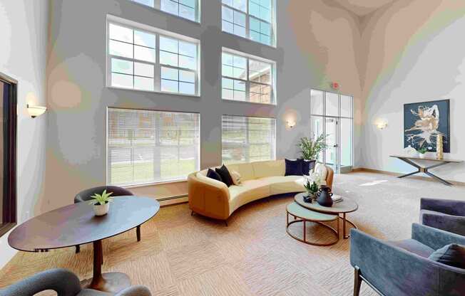 a living room with large windows and a yellow couch