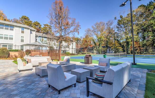 Seating by tennis court at Rosemont Vinings Ridge Apartments, Atlanta, GA