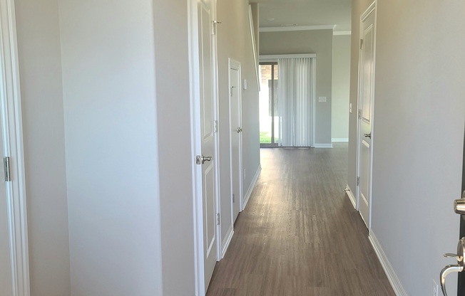 B4 Entry with coat closet and laminate wood flooring