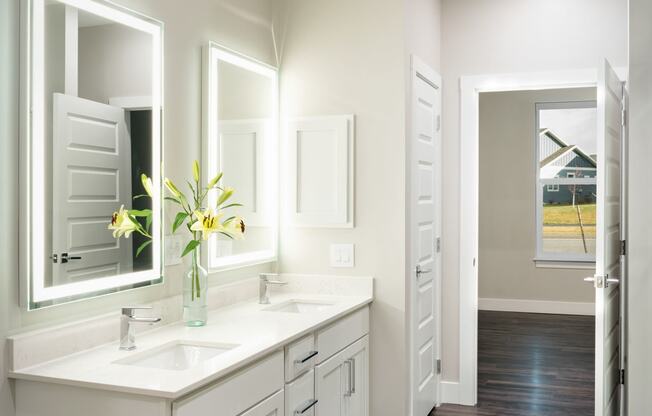 Bathroom with vanity and toilet at Icon Apartment Homes at Ferguson Farm, Bozeman