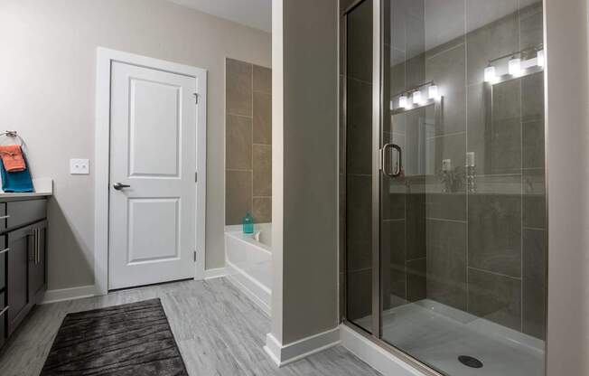 A Bathroom With a White Door at The Aster Apartments, Cary, North Carolina