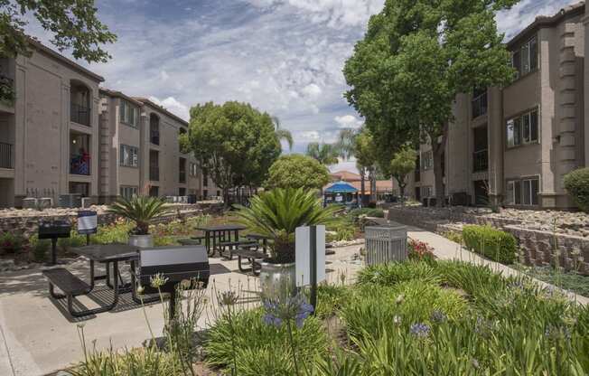 Outdoor Grill With Intimate Seating Area at Bella Vista Apartments