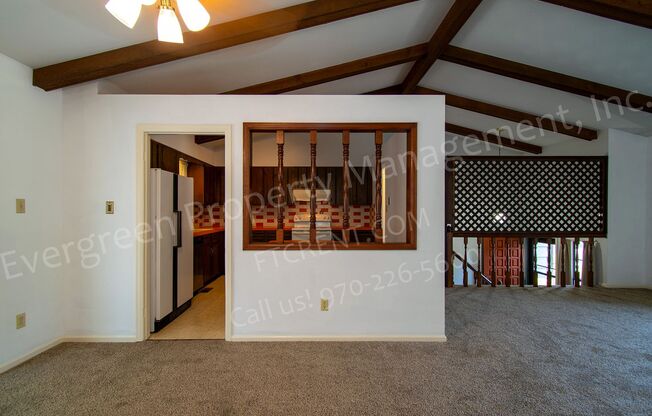 Charming Bi-Level Home in Desirable Mission Hills with a Sunroom, A/C and a Fireplace!